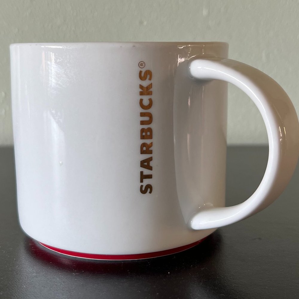 Starbucks 2012  Pearl White Coffee Mug Red Raised Base Metallic Gold 16oz  Cup
